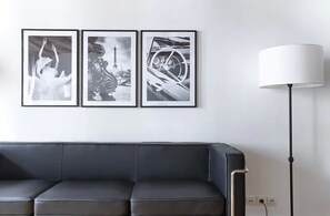 A very bright,ultra cozy, design &comfortable living room with a large sofa bed
