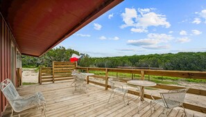 Enjoy the outdoors with a private patio offering beautiful views of the surrounding land. It's an ideal spot for sipping coffee, dining al fresco, or simply relaxing while soaking in the natural beauty.