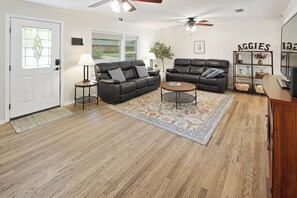 Living room with 2 leather sofas with TWO recliners on EACH COUCH! 