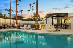 Stunning pool with loungers and umbrellas