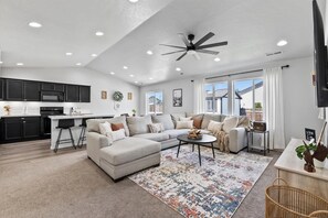 Open, bright and relaxing living area with vaulted ceilings, the perfect place to gather.