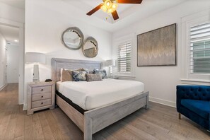 Retreat to the master suite featuring a plush king-sized bed.