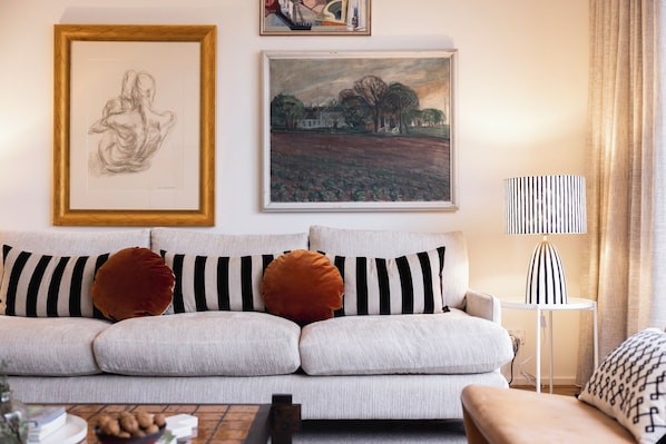 Relax in the open plan, beautifully curated lounge room, perfect for unwinding in style.
