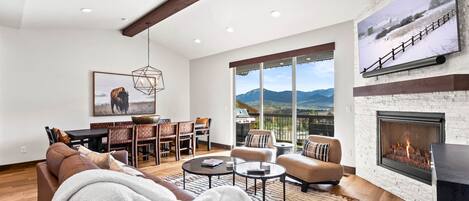 Black Rock Ridge 14544: Cozy space with dining table, sofa, and access to outdoor patio.