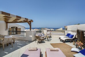 The veranda offers a beautiful sea view and overlooks the village and quaint main street below. 