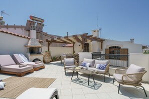 The rooftop terrace offers a seating area, sun beds, BBQ facilities and shaded dining area!