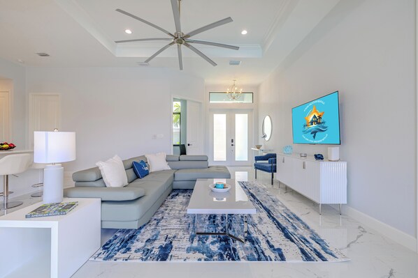 Gathering Space - - Unwind in this welcoming living room, complete with stylish decor and comfortable seating
- Bright and airy, the space features high ceilings and modern finishes
- Perfect for movie nights, casual conversations, or relaxing with loved ones