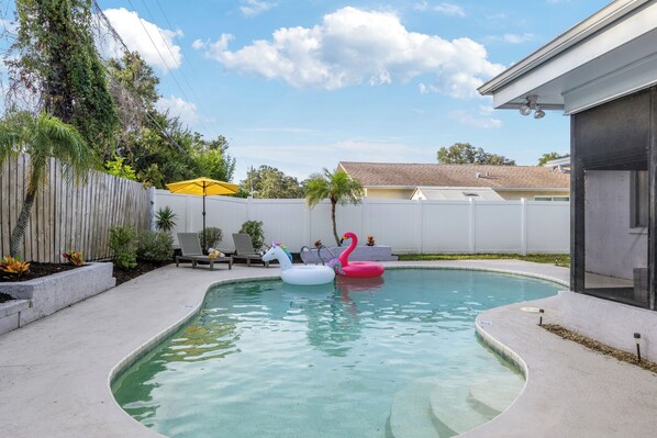 {POOL} Relax by the pool with loungers, floaties, and kids' vests.