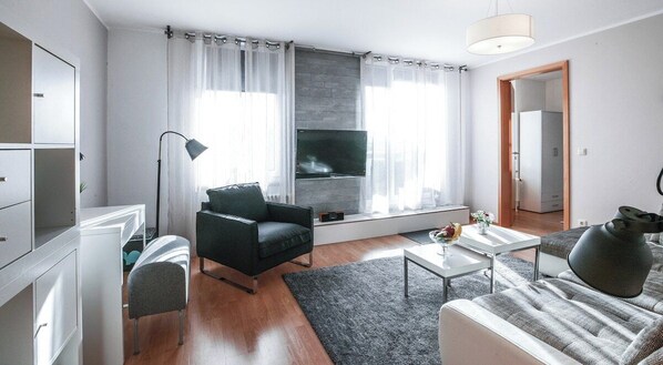 Living room with door towards your inviting terrace and very fast Wi-Fi. 