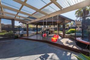 Kids will love the play equipment outside, including swings and a trampoline.