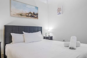 As you enter the bedroom, the sophisticated decor and plush bedding create a space where you can truly unwind.