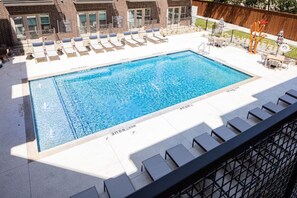 You can imagine yourself lounging by the pool, surrounded by greenery and the gentle sound of water.