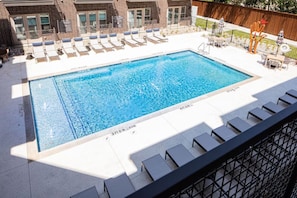 You can imagine yourself lounging by the pool, surrounded by greenery and the gentle sound of water.