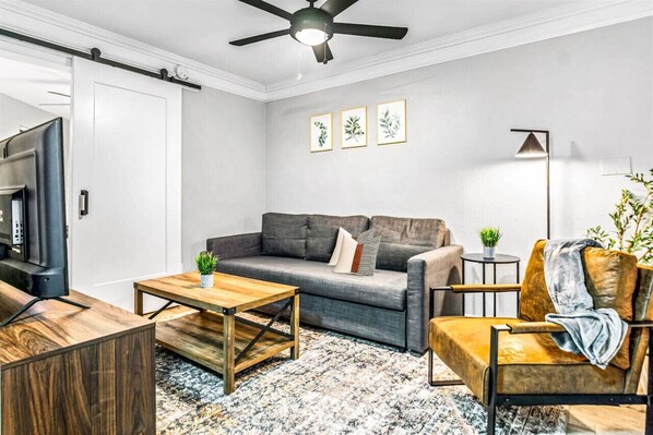 Once you enter the living room you'll find a space that feels both luxurious and cozy, perfect for unwinding after a long day.