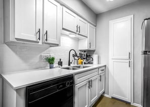 As you step into the kitchen, the clean lines and functional design make you eager to start cooking your favorite dishes.
