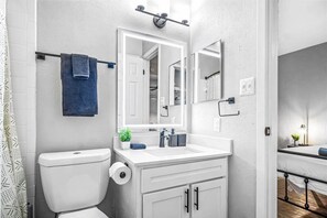 You feel a sense of calm as you enter the bathroom, where the thoughtful design and high-quality materials create a serene environment.