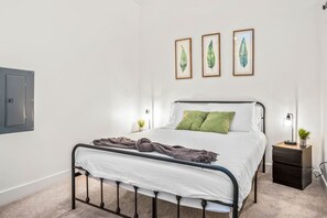 The bedroom offers a luxurious retreat, with a bed that promises restful nights and a room that feels like a private oasis.