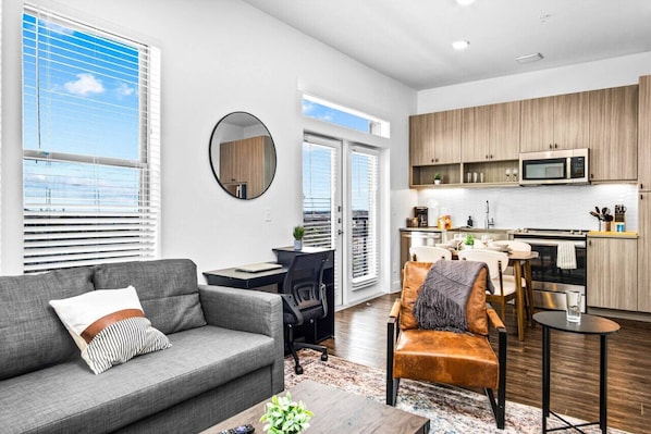 Spacious living room with stylish decor, perfect for unwinding after a day of exploring the local area.