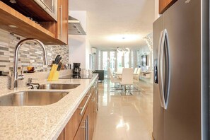 Enjoy cooking in our fully equipped kitchen with a sleek open layout.