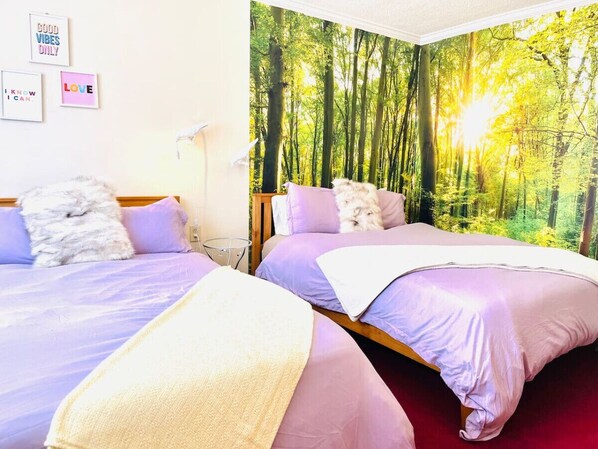 The apartments two queen sized beds have cozy, hotel style bedding and memory foam mattresses for your comfort. (winter bedding shown in the picture).