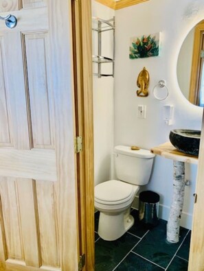 We're sure you enjoy the tastefully appointed state of the art bathroom with "Hampton" slate tiles and wood accents.