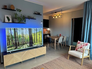 Living room with 70 inch TV and free Netflix