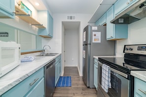 The kitchen is fully equipped with modern appliances.