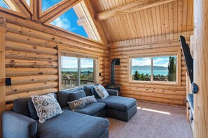Relax in our cozy living room with panoramic views of Bear Lake, offering the perfect blend of comfort and natural beauty. As you wind down with your favorite movie on our Smart Roku TV, let the natural beauty and comfort surround you