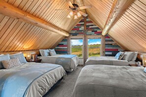 Rest comfortably in our spacious loft featuring four queen beds and breathtaking views, perfect for families or group retreats