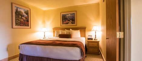 Inviting bedroom with a queen bed and warm lighting