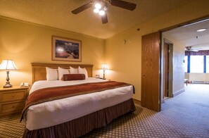 Warm bedroom with a queen bed and soft lighting