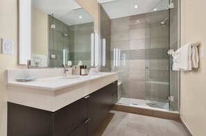 Contemporary bathroom with a walk-in shower and sleek finishes.