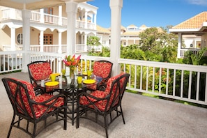 The covered patio has views of the tropical garden