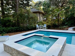 Enjoy a beautiful pool and spa, with multiple seating areas and a glimpse of the Heron Pointe golf course.
