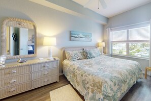 Primary Bedroom: Featuring a king-size bed and en-suite full bathroom.