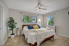 Elegant bedroom with a king bed, offering ample space and relaxation.
