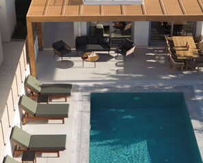 Unwind in the tranquil pool area, where elegance meets nature.