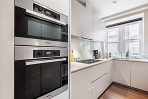 The kitchen is fully equipped to prepare a simple meal