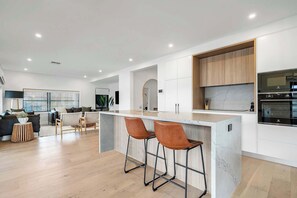 Enjoy the ultimate in comfort and style with a kitchen and lounge area designed for seamless living