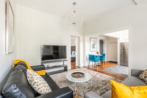 Bright Living Room With A Smart TV And Elegant Decor
