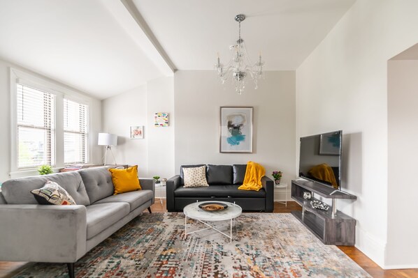 Spacious Living Area With Modern Decor And Smart TV