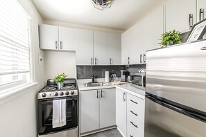 Fully Equipped Kitchen Featuring Stylish Details And Ample Storage