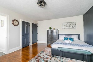 Spacious Bedroom With Queen Bed And Stylish Decor