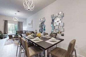 Dine in style at the spacious table, perfect for meals with family or friends.