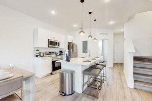 Cook up a storm in a kitchen stocked with all the essentials and modern appliances.
