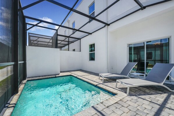 Take a dip in the fully fenced private pool—perfect for relaxing under the Florida sun.