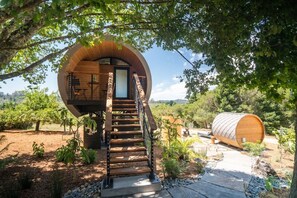 Stone pathway to your private barrel Sauna and outdoor shower