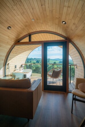 Arched window wall provides natural light and beautiful views!