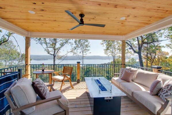 Covered Porch with cozy seating and lake views