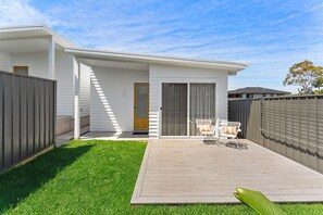 Frontage of retreat with fully enclosed yard